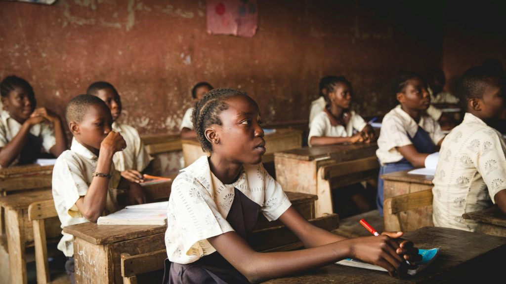 Students attentively listening in class