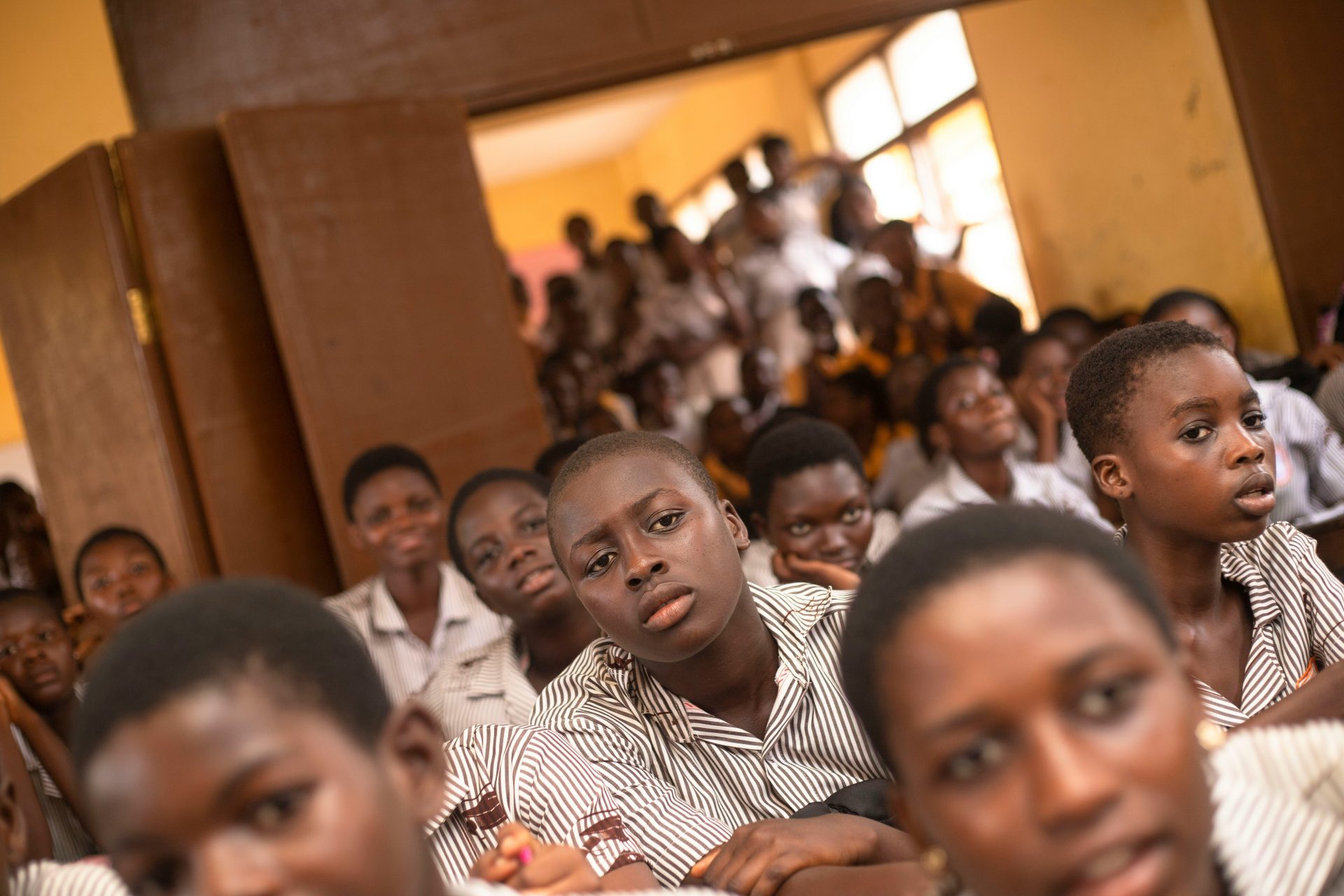 Students attentively listening in class